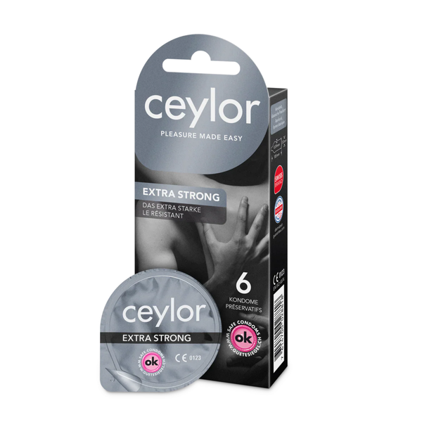 Product photo of a Ceylor 'Extra Strong' condom box containing 6 pieces, standing next to a single opened round foil packet. The packaging is gray and black with white text.