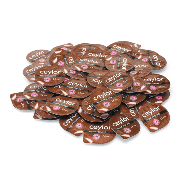 A large pile of Ceylor 'Tight Feeling' condom foil packets, on a white background.
