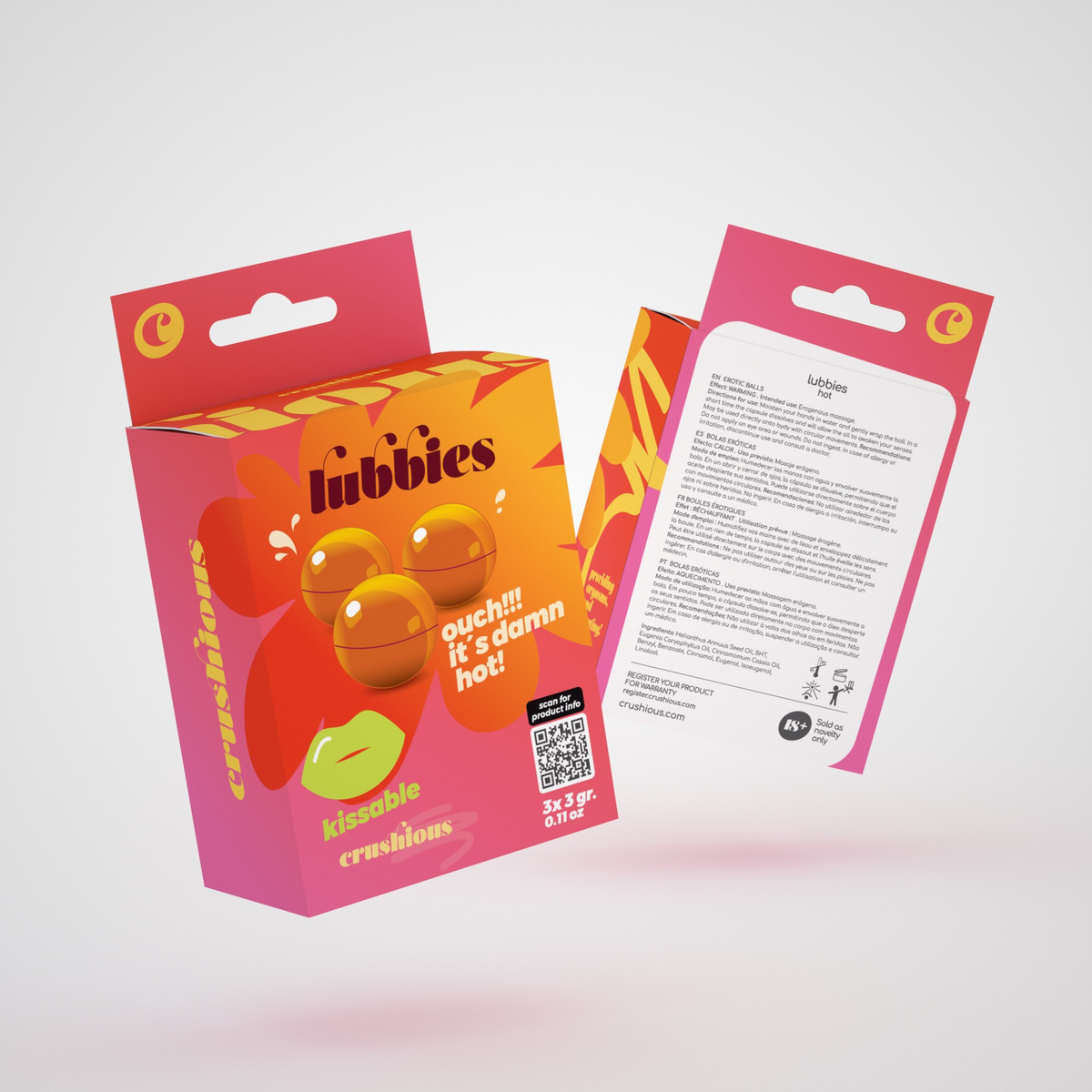 Product packaging shot showing the front and back of the bright pink and orange Crushious Lubbies Hot Oil Balls box containing three 3 g bath/massage spheres, featuring multi-language instructions and ingredient information on the reverse side. Imagen principal del producto