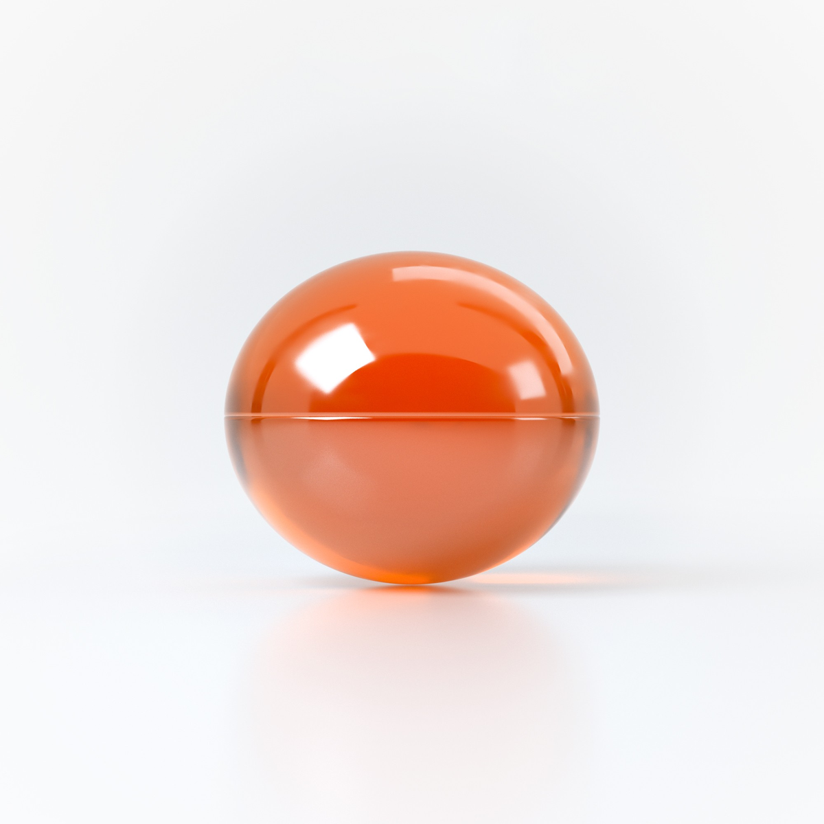 Studio product shot focusing on a single translucent orange oil sphere resting on a clean white reflective surface.