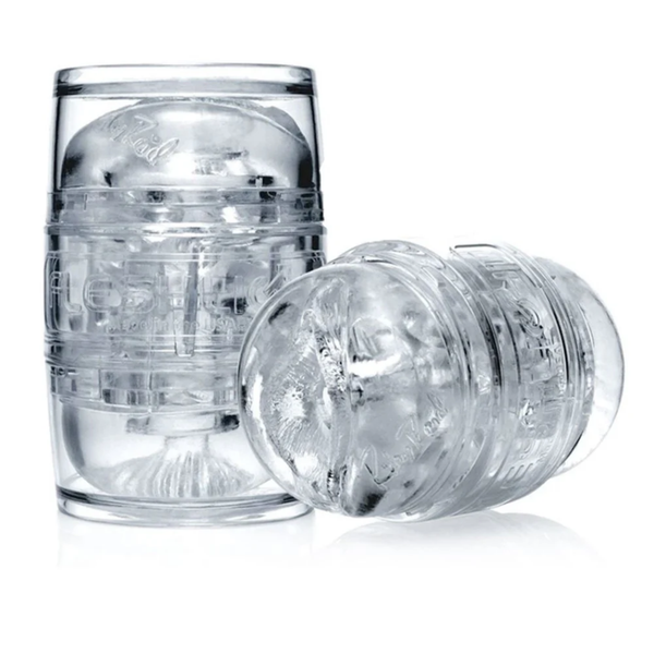 Two clear Riley Reid Fleshlight Quickshot masturbators, one standing upright and one lying horizontally.