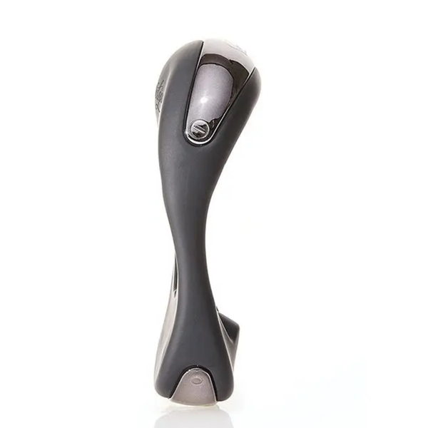 Side profile studio shot of the black Hot Octopuss Atom Plus vibrating c-ring highlighting its slender ergonomic curve and metallic top and bottom accents.