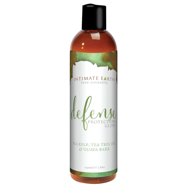 Direct studio shot of the large 240 ml (8 fl oz) amber bottle of Intimate Earth Defense protection glide, highlighting sea kelp, tea tree oil, and guava bark ingredients.