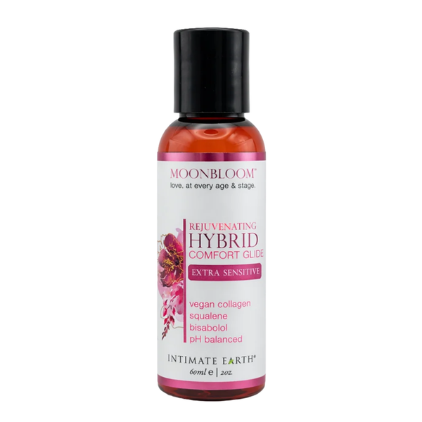 Front studio product view of the travel-sized 60 ml (2 fl oz) amber bottle of Intimate Earth Moon Bloom extra sensitive rejuvenating hybrid comfort glide.