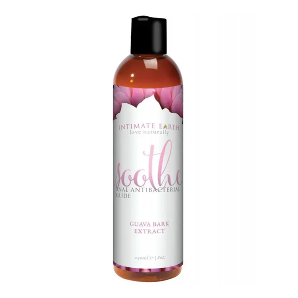 Direct studio shot of the large 240 ml (8 fl oz) amber bottle of Intimate Earth Soothe anal antibacterial glide with pink floral label graphics.