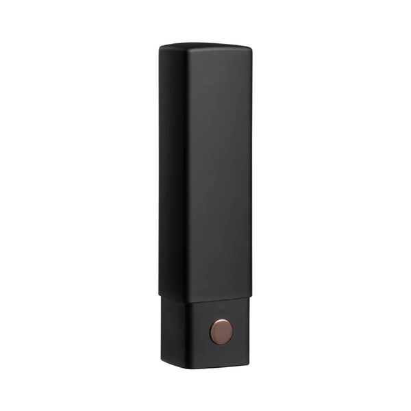 Studio product shot of the Lovense Exomoon vibrator with its rectangular black cap closed for a discreet lipstick look.