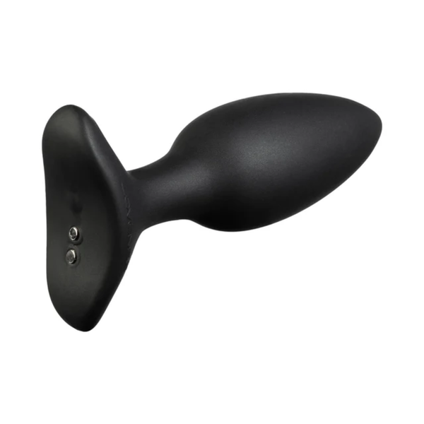 Angled close-up view of the black Lovense Hush 2 base showing its magnetic charging contacts.