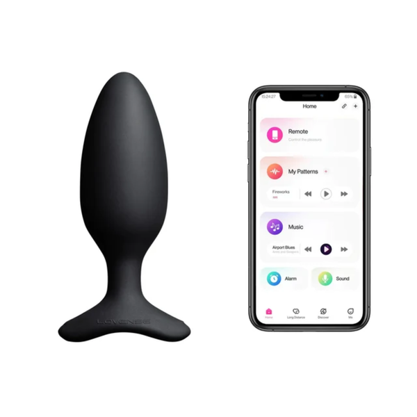 Studio product shot of the black Lovense Hush 2 vibrating butt plug alongside a smartphone running the Lovense remote-control app interface.