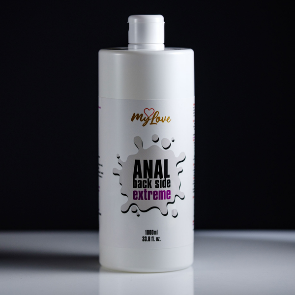 Front view of the 1000 ml MyLove Anal Back Side Extreme bottle standing centered on a white surface against a solid black background.