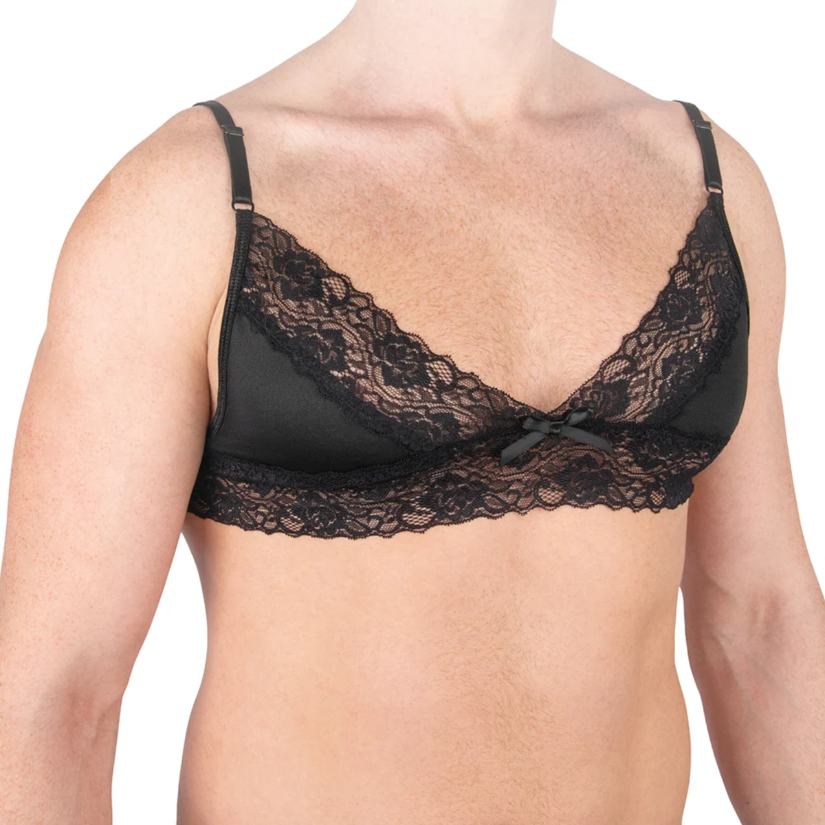Close-up studio shot of a male model wearing the black lace bralette featuring scalloped lace trim, soft cups, adjustable shoulder straps, and a center bow detail.