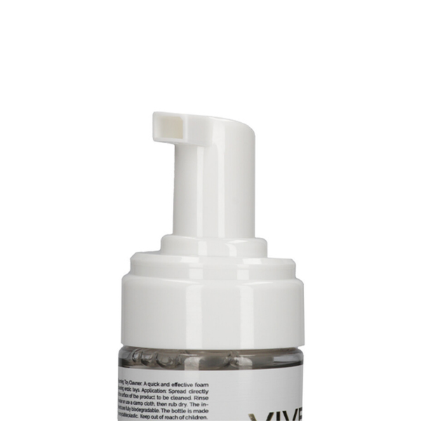 Close-up detailed view of the white plastic dispensing foam pump mechanism on the Shots Vive Toy Cleaner bottle.