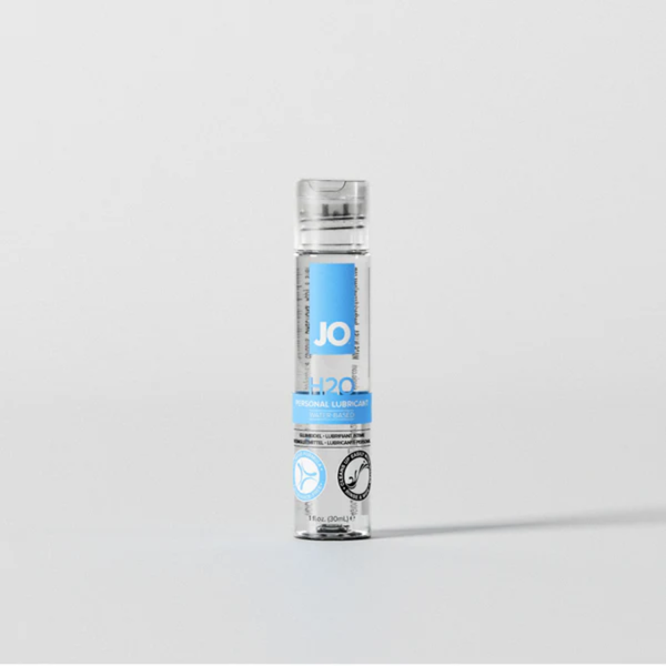 Front view of the smallest 1 fl. oz. (30ml) bottle of System JO H2O Water-Based Personal Lubricant. The slim clear bottle features a clear flip-top cap and stands centered against a light grey background.