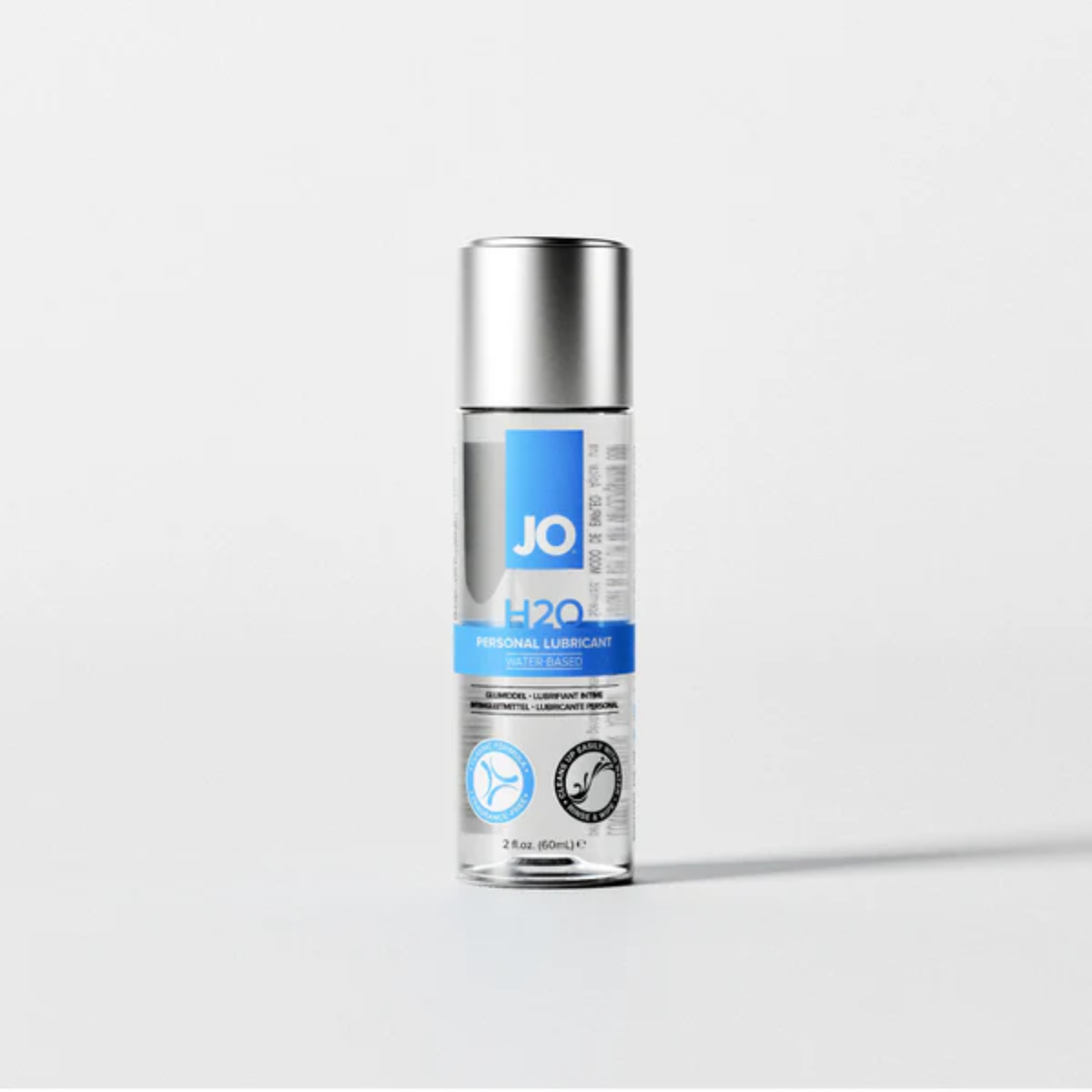 Front view of the 2 fl. oz. (60ml) bottle of System JO H2O Water-Based Personal Lubricant. The clear bottle is fitted with a solid silver cap and features a signature blue and white label.