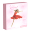 Studio product shot of a light pink Velvet Female Condom 4-pack box standing upright at a three-quarter angle, featuring an image of a dancer in a red dress alongside white floral outlines and product specifications.