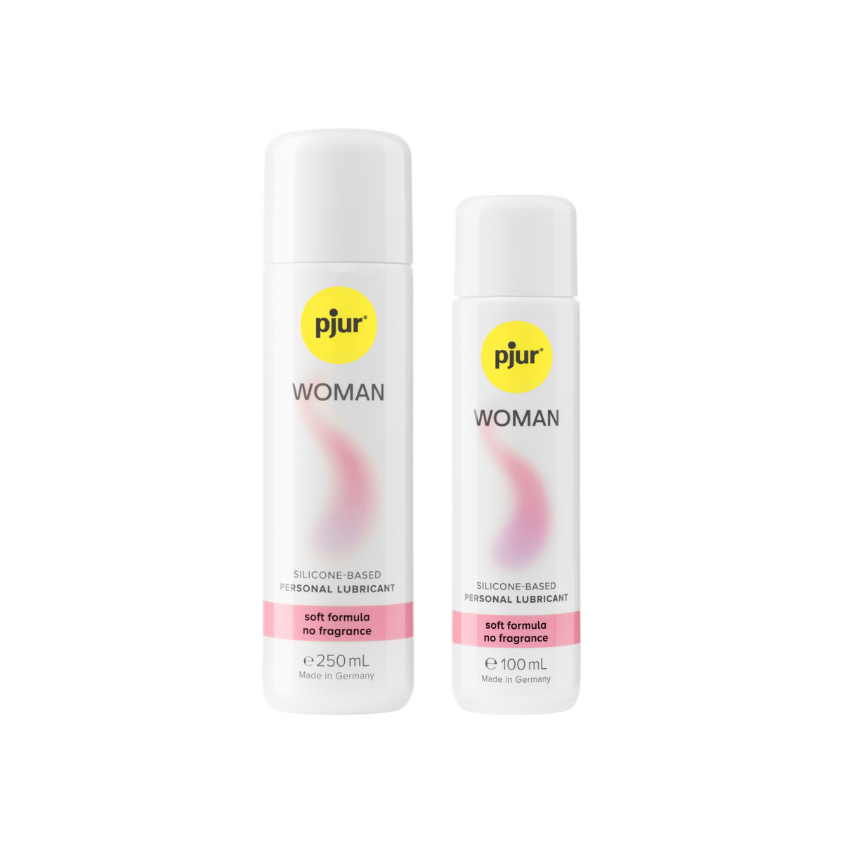 Two white bottles of Pjur Woman silicone-based personal lubricants with a yellow logo and pink label indicating "soft formula no fragrance". Imagen principal del producto